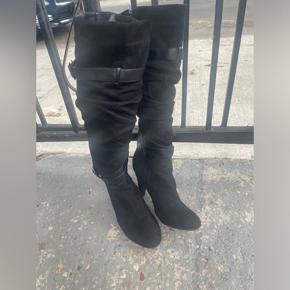 Black knee high heeled boots